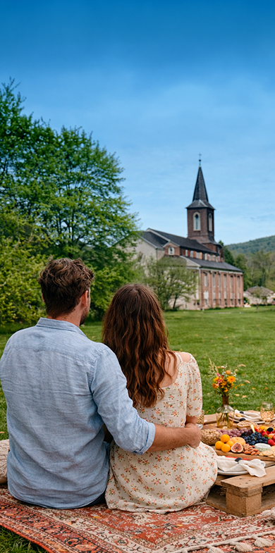 Couple enjoying a romantic picnic in the countryside